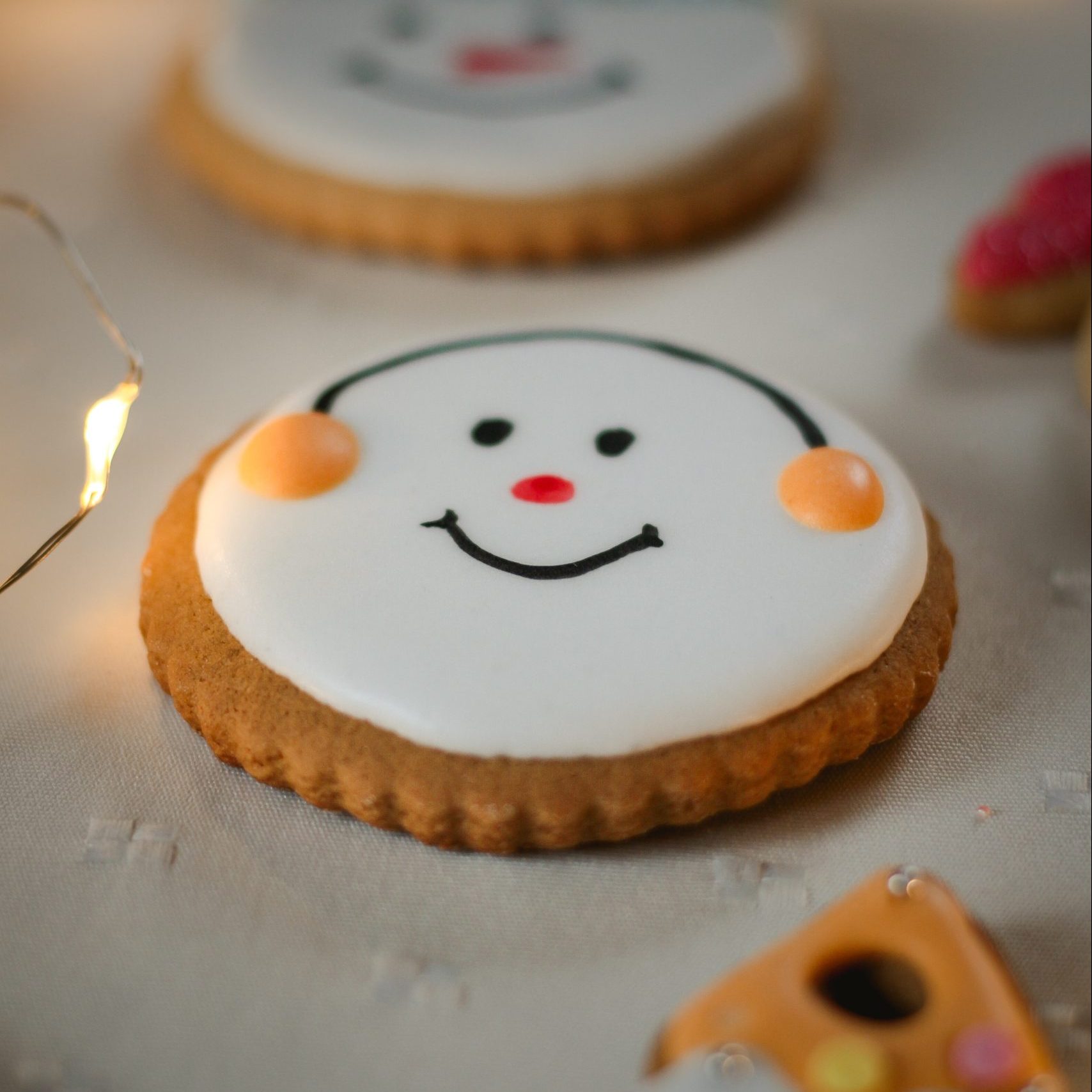 Picture of a Christmas cookie and a smiling face on it.